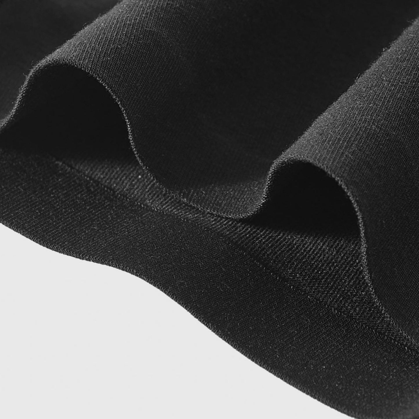 Close-up of black fabric with a plain background