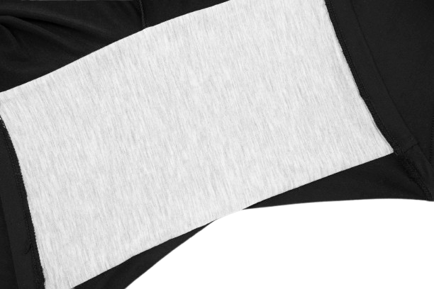 Close-up of a black fabric with a contrasting light gray panel, showcasing a sleek, stylish design.