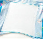 Close-up of a blue fabric with colorful paw prints and a white absorbent pad center, conveying a soft and playful design.