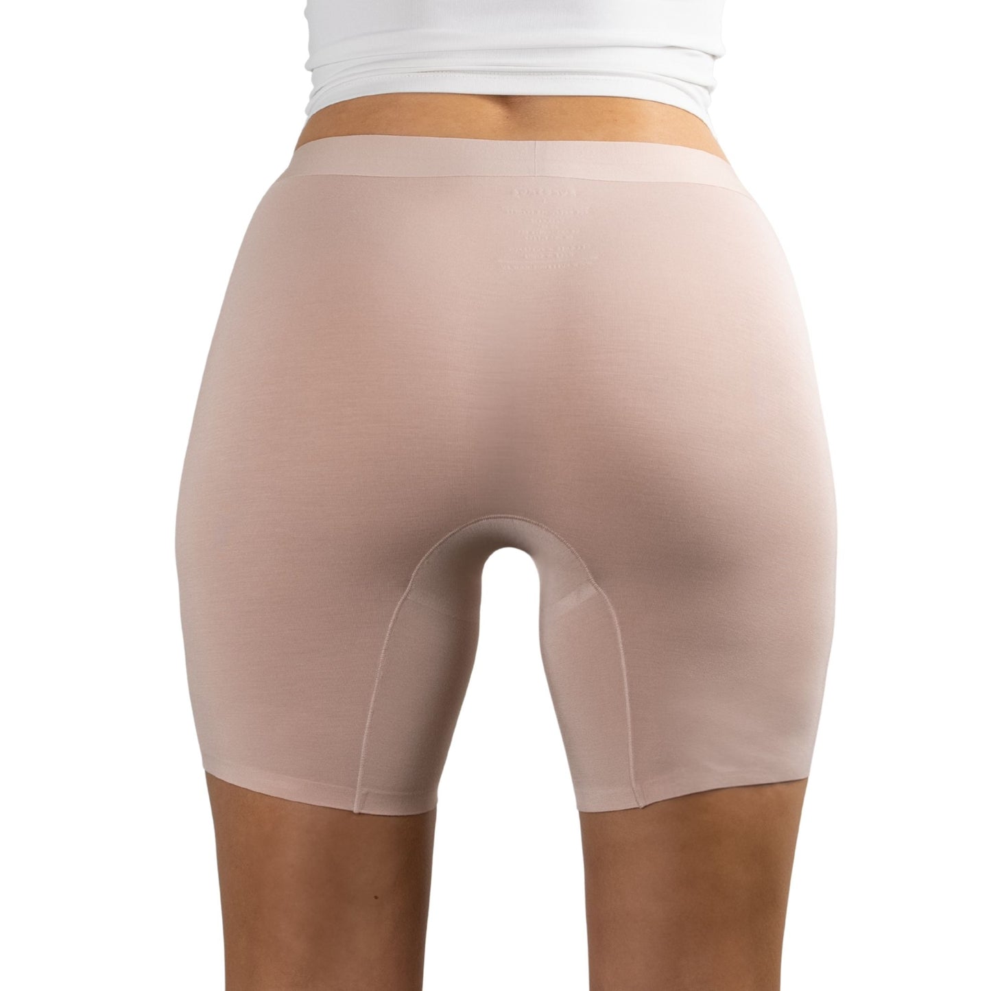 Back view of PureSnug Blush Beige boxer shorts worn by a person on a white background