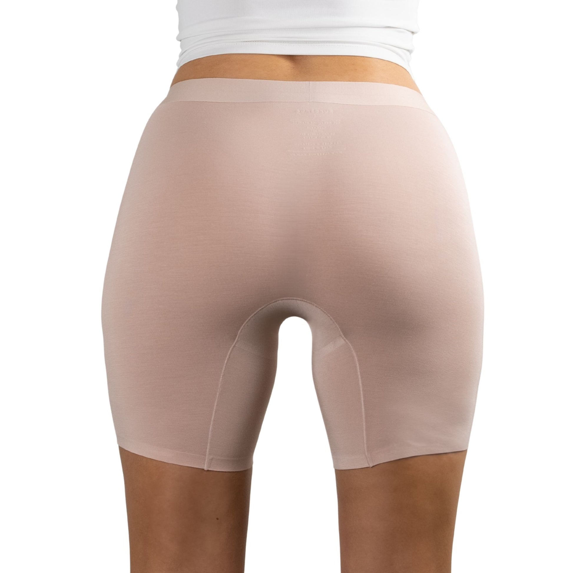 Back view of PureSnug Blush Beige boxer shorts worn by a person on a white background