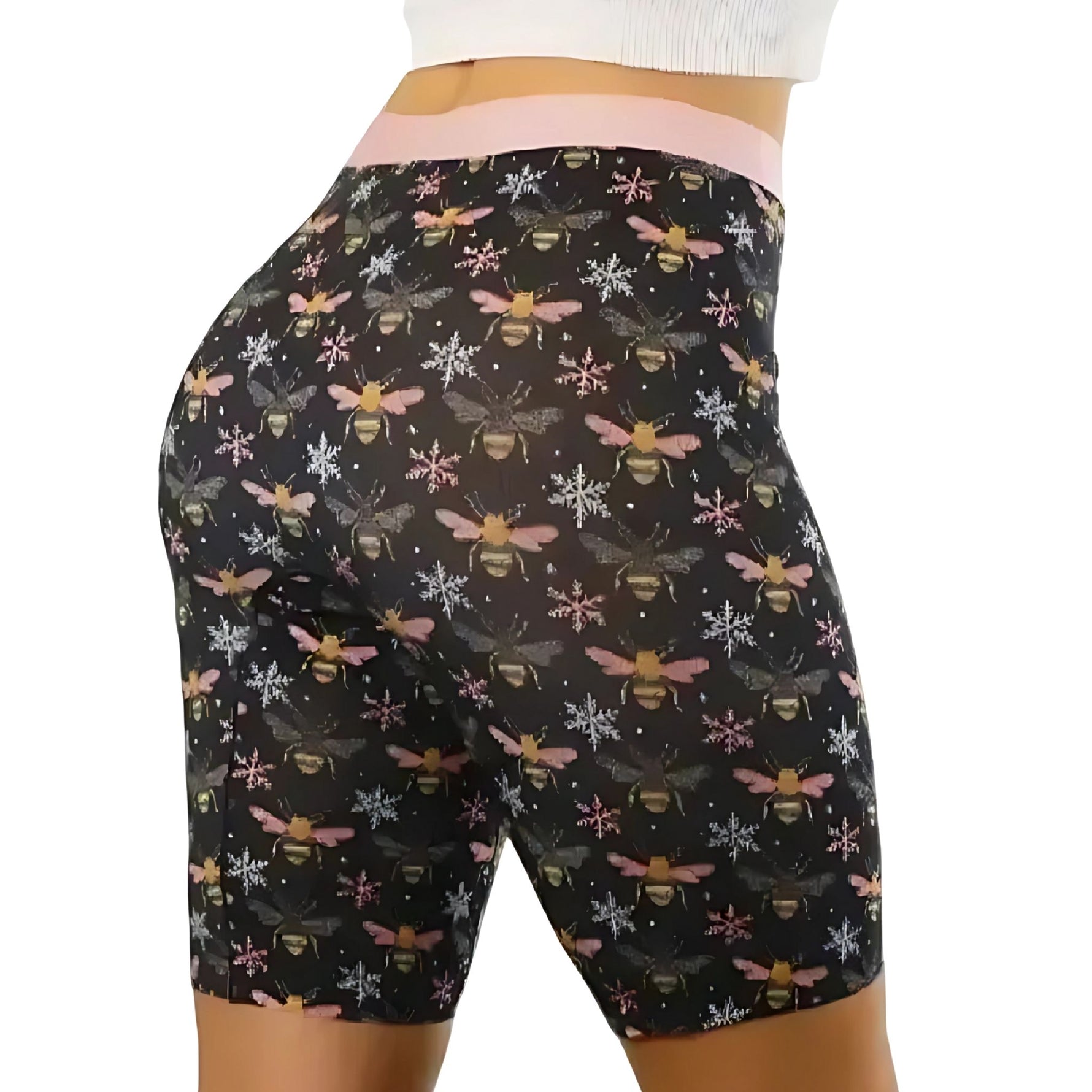 PureSnug black biker shorts with bee & snowflake pattern, worn with white textured top; focus on fit.