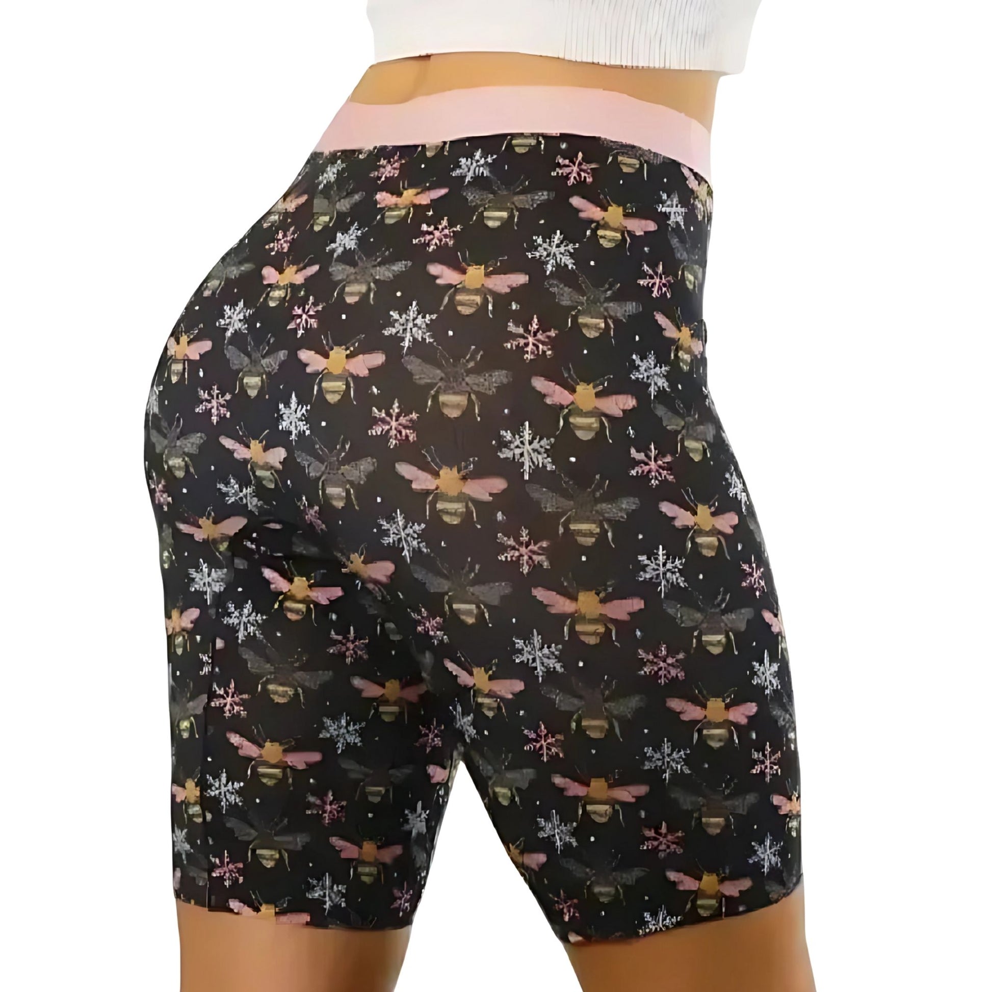 PureSnug black biker shorts with bee & snowflake pattern, worn with white textured top; focus on fit.