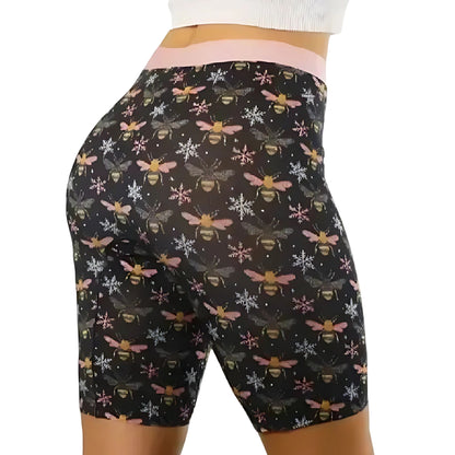 PureSnug black biker shorts with bee & snowflake pattern, worn with white textured top; focus on fit.