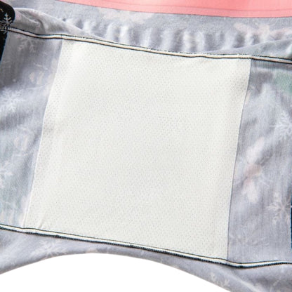 Close-up of a gray and pink fabric with a white attached gusset