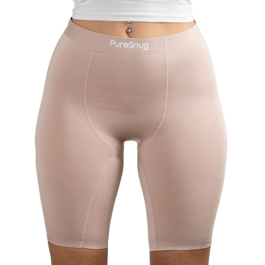 Woman wearing PureSnug's Blush Beige high-waisted biker shorts. 