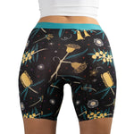 Rear view of Golden Snug by PureSnug women's boxer briefs with vibrant yellow floral pattern and teal waistband