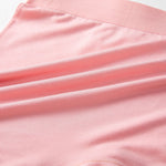 Close-up of pink fabric with a subtle texture