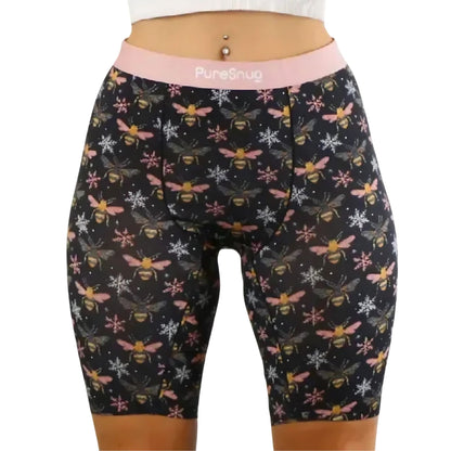 PureSnug Bees 8" biker shorts with pink waistband, bee & snowflake print, paired with white midriff top.