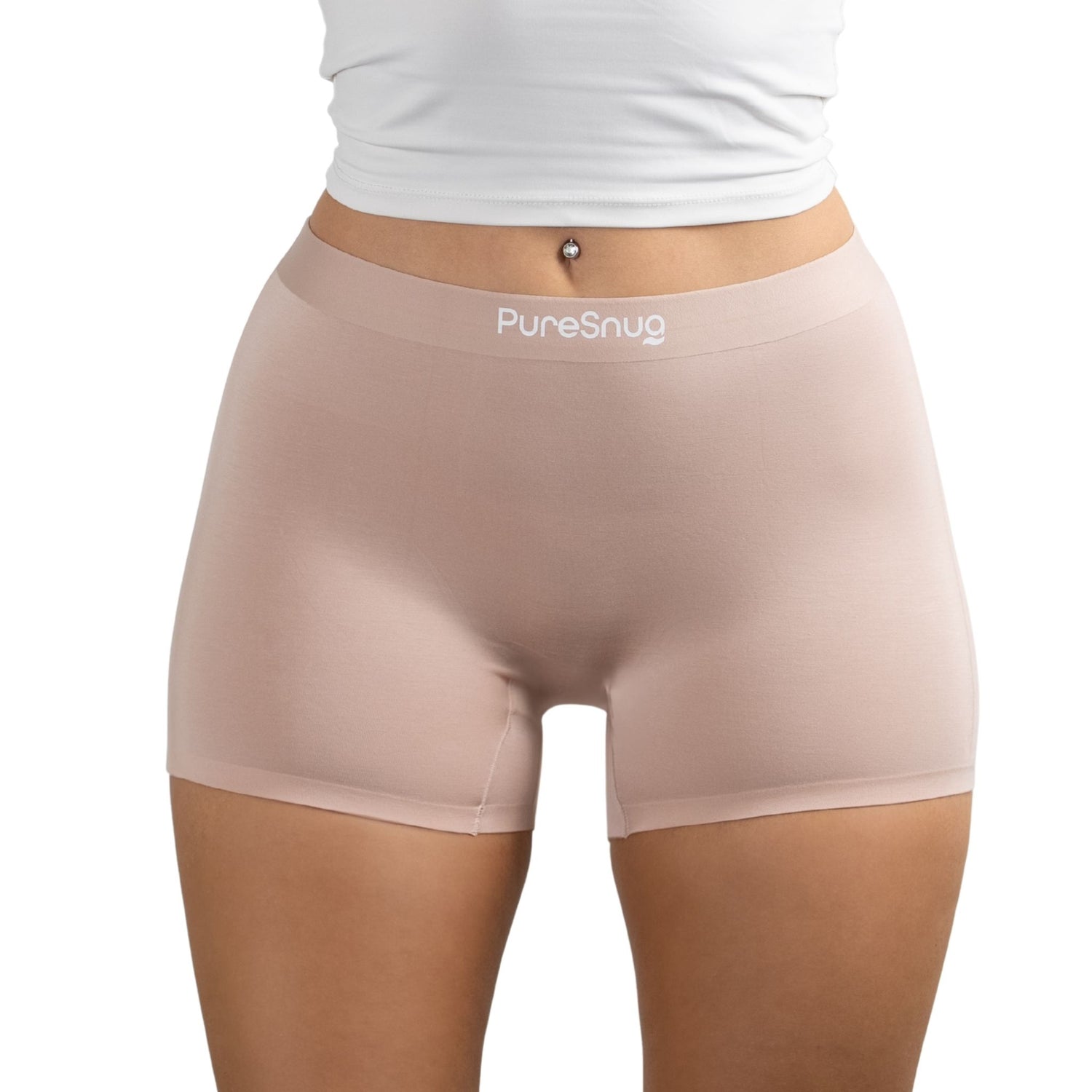 Model wearing PureSnug boyshorts in Blush Beige, focused on shorts and torso area.