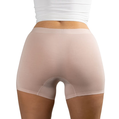 Back view of woman wearing PureSnug's Blush Beige boyshorts made from smooth, stretchy fabric