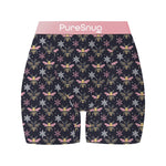 Black shorts with a repeated bee and snowflake pattern in pink waistband and white logo "PureSnug".