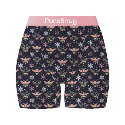 Black shorts with a repeated bee and snowflake pattern in pink waistband and white logo "PureSnug".